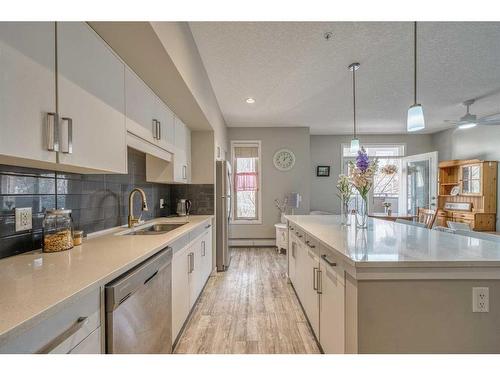 220-7 Westpark Common Sw, Calgary, AB - Indoor Photo Showing Kitchen With Double Sink With Upgraded Kitchen