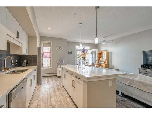 220-7 Westpark Common Sw, Calgary, AB - Indoor Photo Showing Kitchen With Double Sink With Upgraded Kitchen