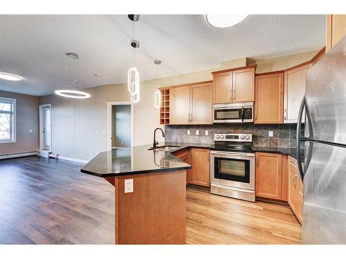 308-35 Aspenmont Heights Sw, Calgary, AB - Indoor Photo Showing Kitchen