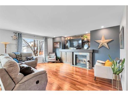 228 Chaparral Circle Se, Calgary, AB - Indoor Photo Showing Living Room With Fireplace