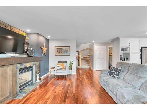 228 Chaparral Circle Se, Calgary, AB - Indoor Photo Showing Living Room With Fireplace