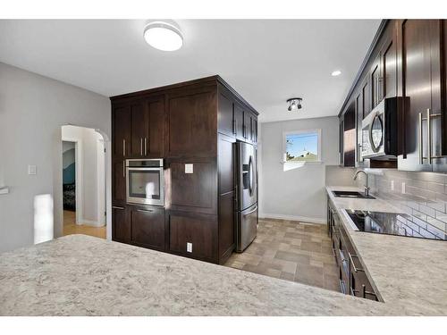 1814 Ramsay Street Se, Calgary, AB - Indoor Photo Showing Kitchen With Double Sink