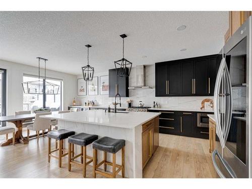 42 Westmore Park Sw, Calgary, AB - Indoor Photo Showing Kitchen With Stainless Steel Kitchen With Upgraded Kitchen