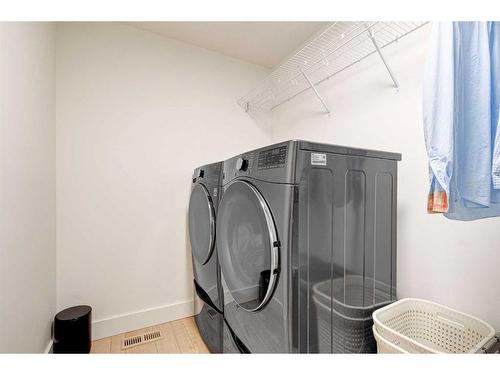 42 Westmore Park Sw, Calgary, AB - Indoor Photo Showing Laundry Room