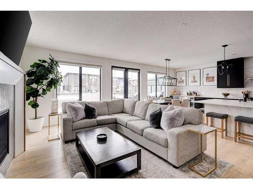 42 Westmore Park Sw, Calgary, AB - Indoor Photo Showing Living Room With Fireplace