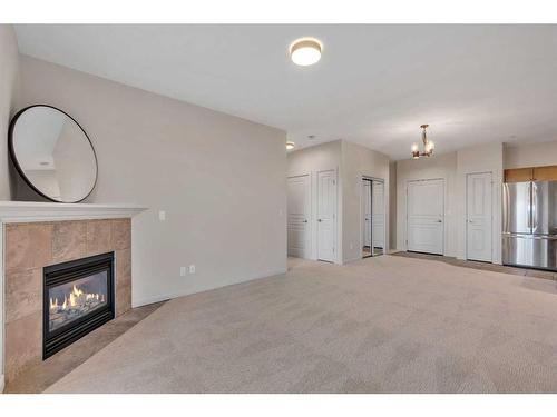 129-52 Cranfield Link Se, Calgary, AB - Indoor Photo Showing Living Room With Fireplace