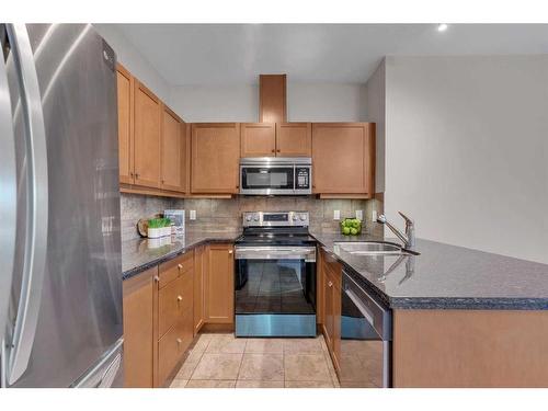 129-52 Cranfield Link Se, Calgary, AB - Indoor Photo Showing Kitchen With Double Sink