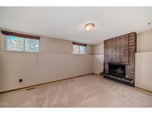 6112 Thornaby Way Nw, Calgary, AB - Indoor With Fireplace