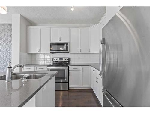 10 Nolanfield Road Nw, Calgary, AB - Indoor Photo Showing Kitchen With Double Sink With Upgraded Kitchen