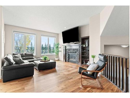 43 Elgin Estates Green Se, Calgary, AB - Indoor Photo Showing Living Room With Fireplace