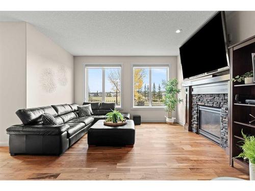 43 Elgin Estates Green Se, Calgary, AB - Indoor Photo Showing Living Room With Fireplace