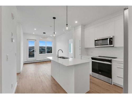 4311-111 Wolf Creek Drive Se, Calgary, AB - Indoor Photo Showing Kitchen With Double Sink With Upgraded Kitchen