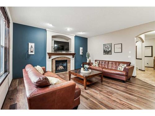 119 Chapalina Mews Se, Calgary, AB - Indoor Photo Showing Living Room With Fireplace