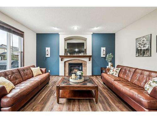 119 Chapalina Mews Se, Calgary, AB - Indoor Photo Showing Living Room With Fireplace