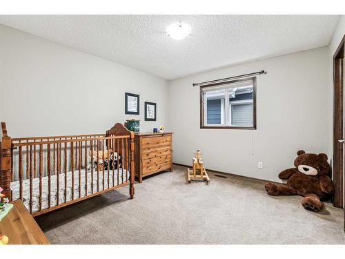 119 Chapalina Mews Se, Calgary, AB - Indoor Photo Showing Bedroom