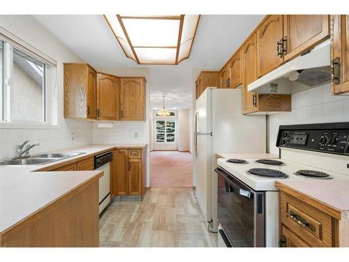 216 Sierra Morena Green Sw, Calgary, AB - Indoor Photo Showing Kitchen With Double Sink