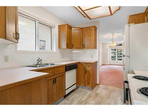 216 Sierra Morena Green Sw, Calgary, AB - Indoor Photo Showing Kitchen With Double Sink