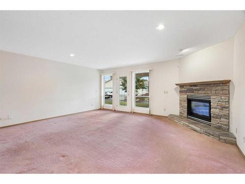 216 Sierra Morena Green Sw, Calgary, AB - Indoor Photo Showing Living Room With Fireplace