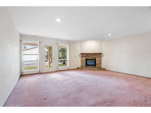 216 Sierra Morena Green Sw, Calgary, AB - Indoor Photo Showing Living Room With Fireplace