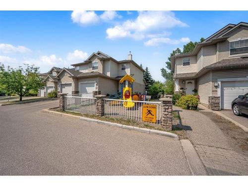 213-2000 Applevillage Court, Calgary, AB - Outdoor With Facade