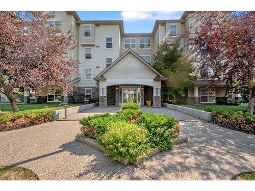 213-2000 Applevillage Court, Calgary, AB - Outdoor With Facade