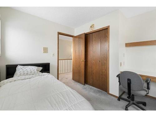 669 Hawkwood Boulevard Nw, Calgary, AB - Indoor Photo Showing Bedroom