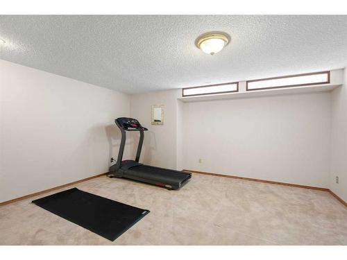 669 Hawkwood Boulevard Nw, Calgary, AB - Indoor Photo Showing Gym Room