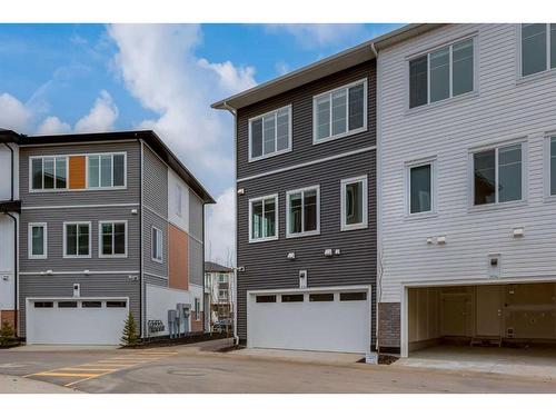 205-6 Merganser Drive West, Chestermere, AB - Outdoor With Facade