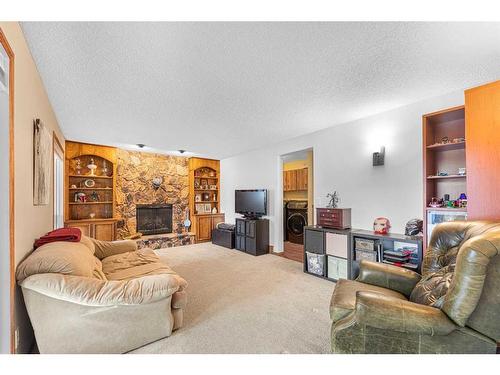 15 Deermont Road Se, Calgary, AB - Indoor Photo Showing Living Room With Fireplace