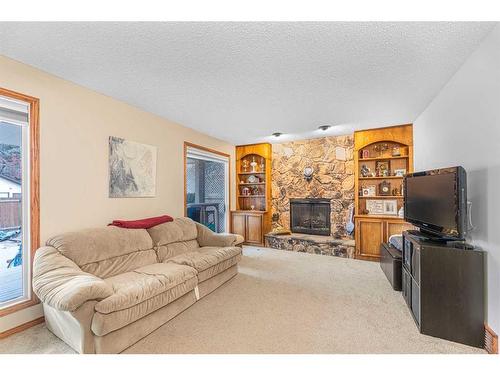 15 Deermont Road Se, Calgary, AB - Indoor Photo Showing Living Room With Fireplace