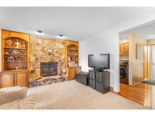 15 Deermont Road Se, Calgary, AB - Indoor Photo Showing Living Room With Fireplace