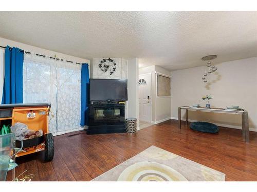 55-3705 Fonda Way Se, Calgary, AB - Indoor Photo Showing Living Room With Fireplace