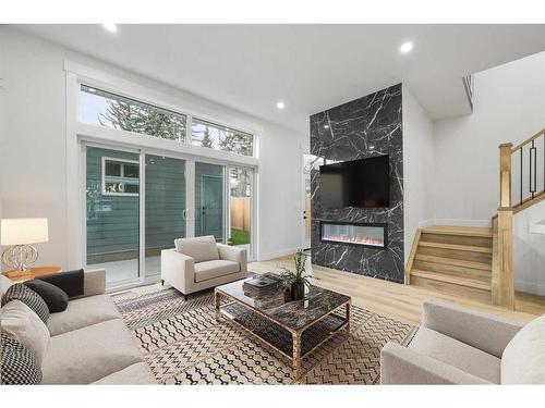 109 Hartford Road Nw, Calgary, AB - Indoor Photo Showing Living Room With Fireplace