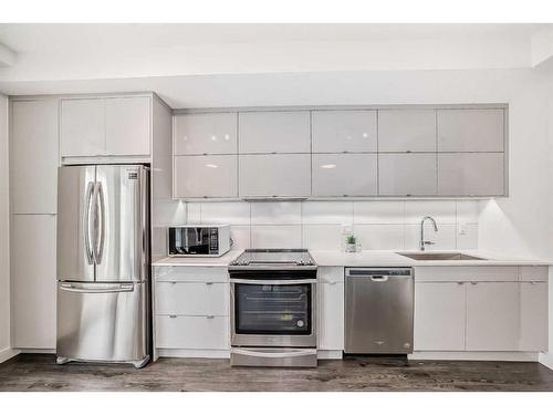 104-100 Auburn Meadows Common Se, Calgary, AB - Indoor Photo Showing Kitchen With Stainless Steel Kitchen With Upgraded Kitchen