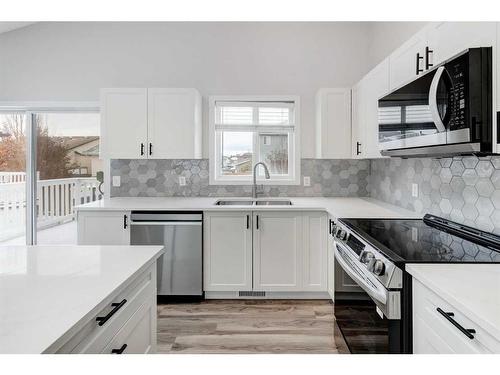 55 Willowbrook Crescent Nw, Airdrie, AB - Indoor Photo Showing Kitchen With Stainless Steel Kitchen With Double Sink With Upgraded Kitchen