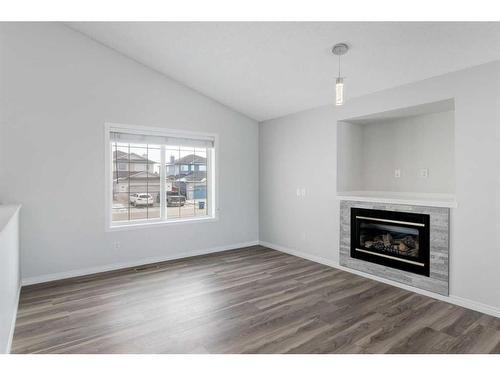 55 Willowbrook Crescent Nw, Airdrie, AB - Indoor Photo Showing Living Room With Fireplace