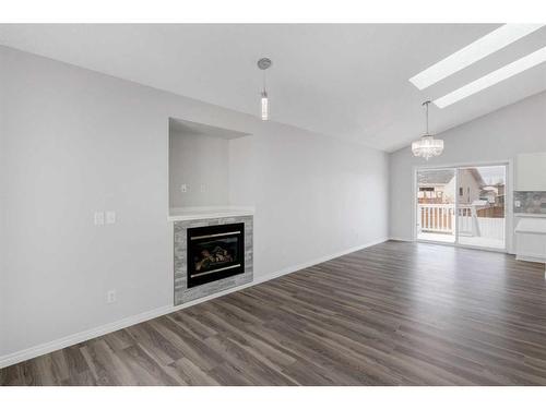 55 Willowbrook Crescent Nw, Airdrie, AB - Indoor Photo Showing Living Room With Fireplace