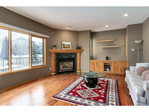 12 Arbour Glen Green Nw, Calgary, AB - Indoor Photo Showing Living Room With Fireplace