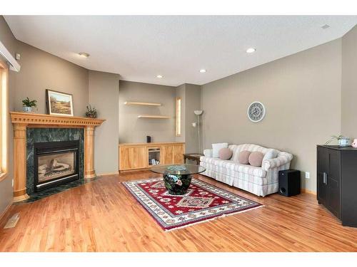 12 Arbour Glen Green Nw, Calgary, AB - Indoor Photo Showing Living Room With Fireplace