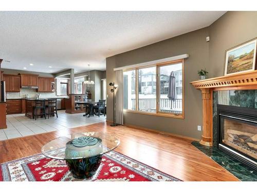 12 Arbour Glen Green Nw, Calgary, AB - Indoor Photo Showing Living Room With Fireplace