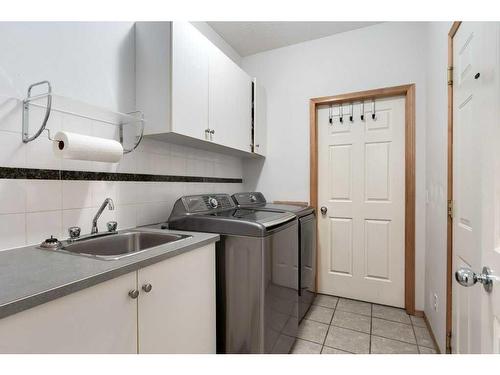 12 Arbour Glen Green Nw, Calgary, AB - Indoor Photo Showing Laundry Room