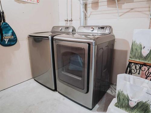 207 Cranberry Way Se, Calgary, AB - Indoor Photo Showing Laundry Room