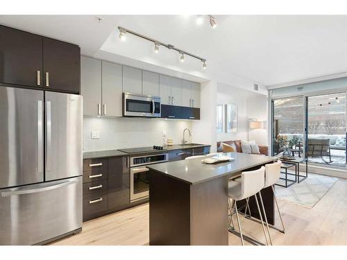 303-550 Riverfront Avenue Se, Calgary, AB - Indoor Photo Showing Kitchen With Upgraded Kitchen