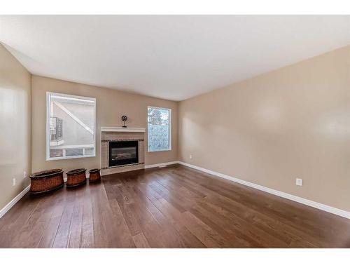 604 Westchester Road, Strathmore, AB - Indoor Photo Showing Living Room With Fireplace