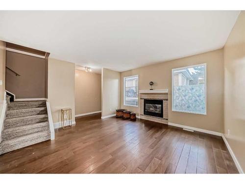 604 Westchester Road, Strathmore, AB - Indoor Photo Showing Living Room With Fireplace