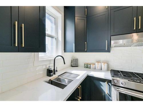 1468 Coopers Landing Sw, Airdrie, AB - Indoor Photo Showing Kitchen With Double Sink With Upgraded Kitchen