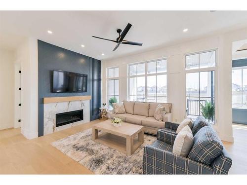 1468 Coopers Landing Sw, Airdrie, AB - Indoor Photo Showing Living Room With Fireplace