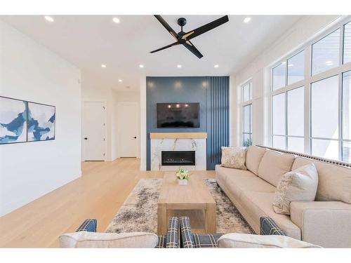 1468 Coopers Landing Sw, Airdrie, AB - Indoor Photo Showing Living Room With Fireplace