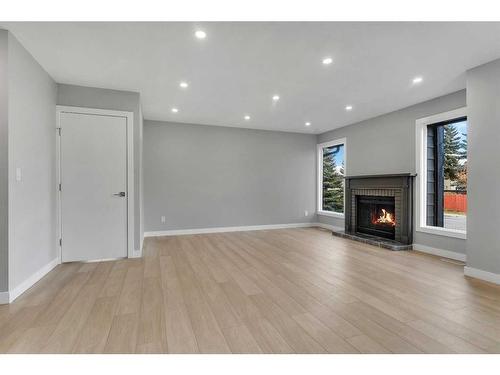 19 Deer Lane Road Se, Calgary, AB - Indoor Photo Showing Other Room With Fireplace