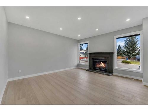 19 Deer Lane Road Se, Calgary, AB - Indoor Photo Showing Other Room With Fireplace